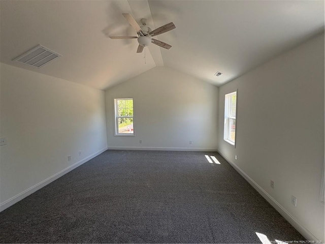 22 Peach Orchard Ln, Lillington, NC 27546 - unfurnished room featuring lofted ceiling, ceiling fan, baseboards, and dark colored carpet