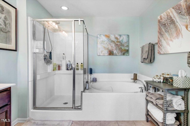 full bathroom with a garden tub, recessed lighting, a stall shower, vanity, and tile patterned flooring