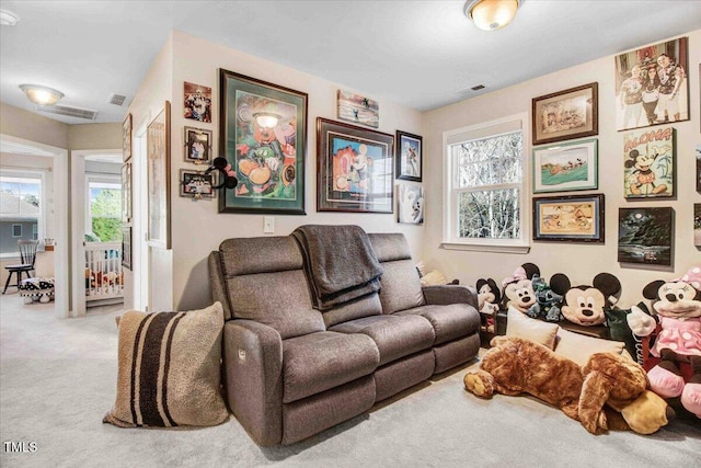 living room featuring carpet flooring and visible vents