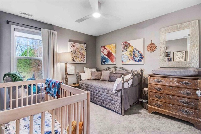 bedroom with ceiling fan and carpet flooring