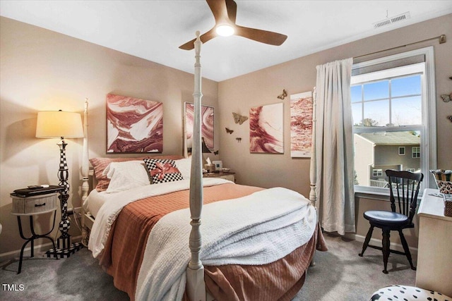 bedroom featuring a ceiling fan, baseboards, visible vents, and carpet flooring