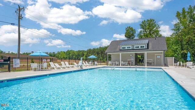 517 Old Battle Bridge Rd, Wendell, NC 27591 - pool with a patio, an outbuilding, and fence