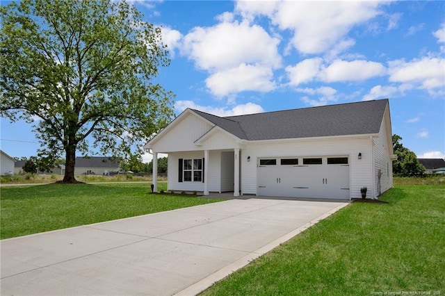 single story home featuring a garage, concrete driveway, and a front yard