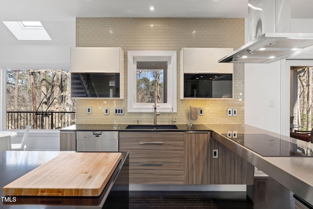 kitchen with a sink, a wealth of natural light, island exhaust hood, and dishwasher