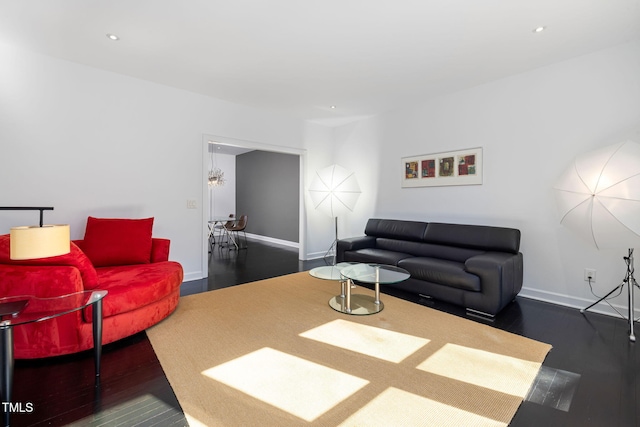 living room with baseboards, dark wood-style flooring, and recessed lighting