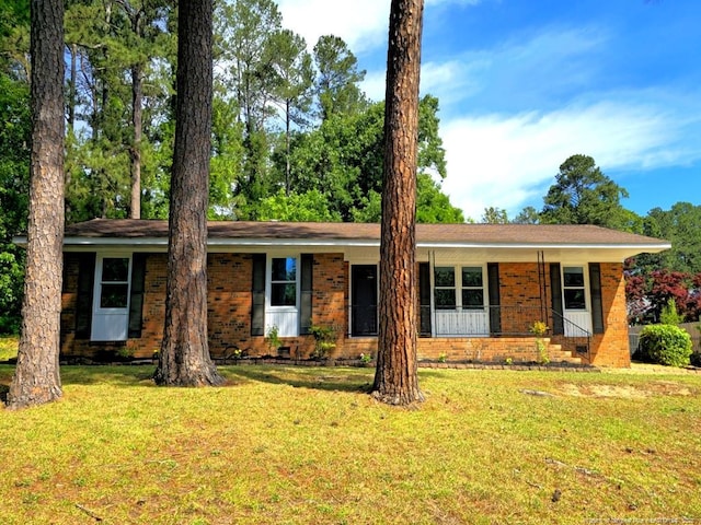 1612 Rogers Dr, Fayetteville, NC 28303 - ranch-style house with brick siding, a front yard, and a porch