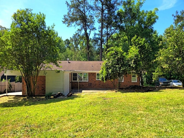 1612 Rogers Dr, Fayetteville, NC 28303 - rear view of house with brick siding