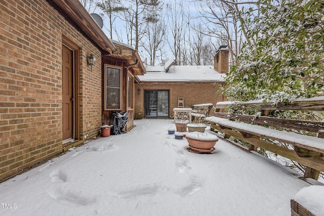 view of snow covered patio