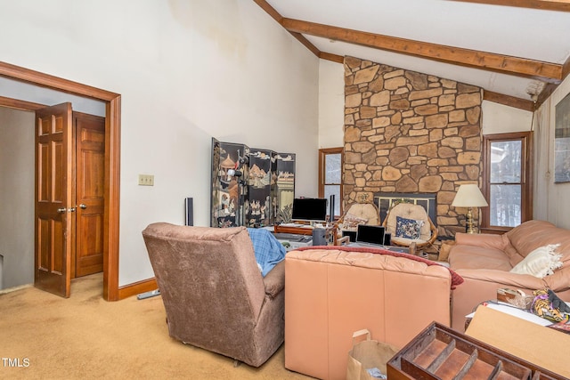 living room with baseboards, light colored carpet, a stone fireplace, high vaulted ceiling, and beam ceiling