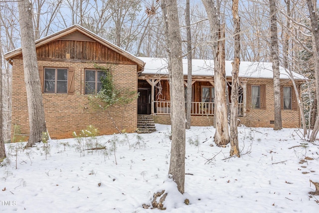 single story home featuring brick siding