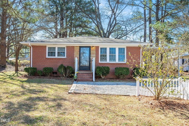 view of front of home with brick siding and a front lawn