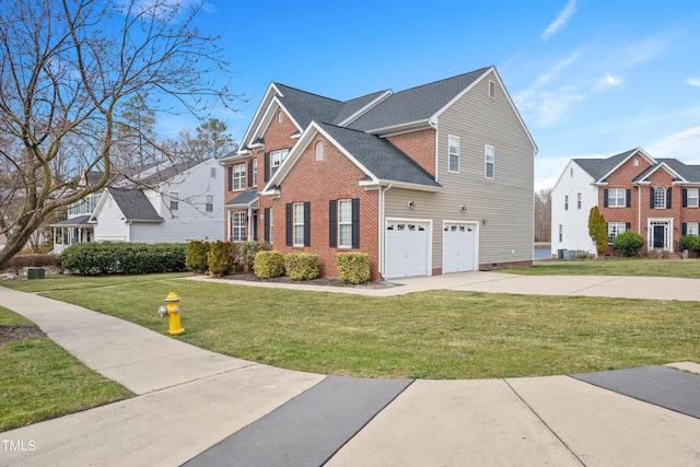 view of side of home featuring brick siding, an attached garage, a shingled roof, a yard, and driveway