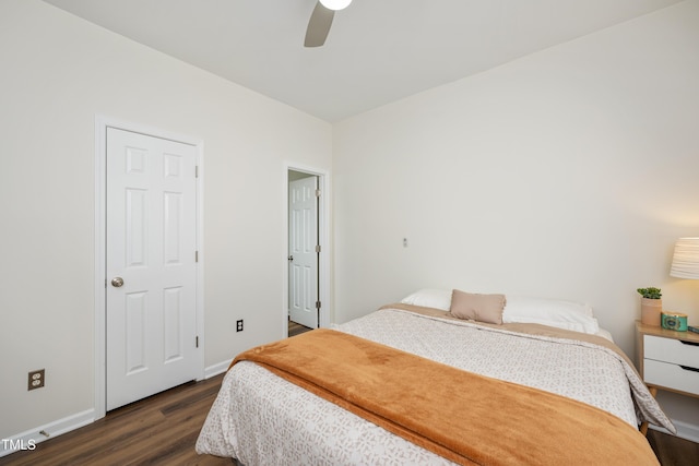 bedroom with ceiling fan, baseboards, and dark wood-style floors