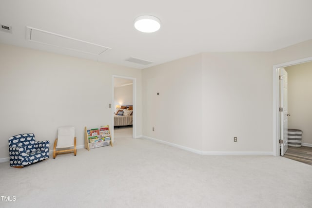 recreation room featuring baseboards, attic access, and carpet flooring