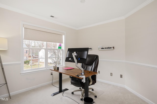 carpeted home office featuring crown molding, visible vents, and baseboards