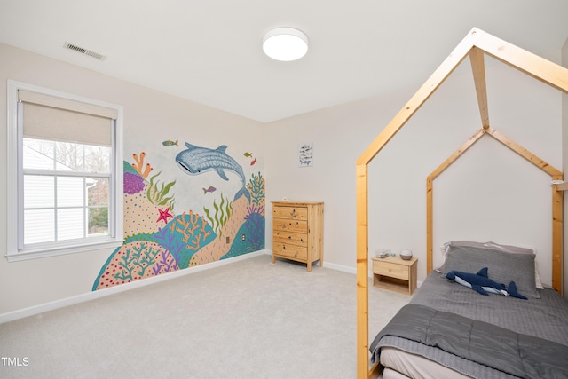 bedroom with visible vents, baseboards, and carpet flooring