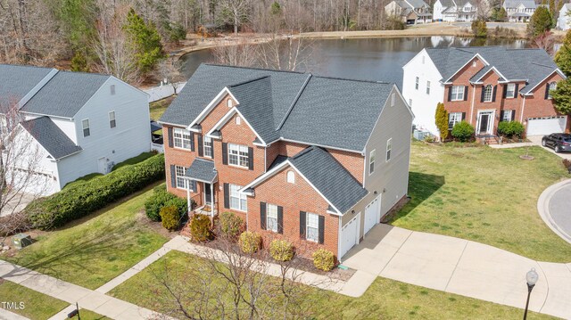 bird's eye view featuring a residential view and a water view