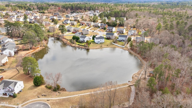 drone / aerial view featuring a residential view and a water view