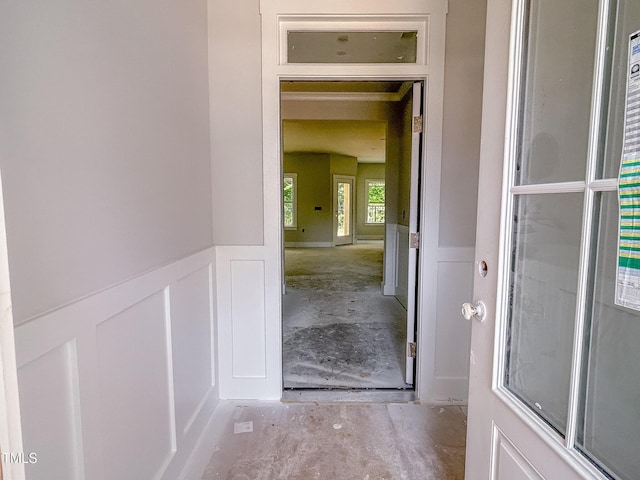 1905 Old Bramble Ln Unit 4, Fuquay Varina, NC 27526 - hallway with concrete floors, a wainscoted wall, and a decorative wall