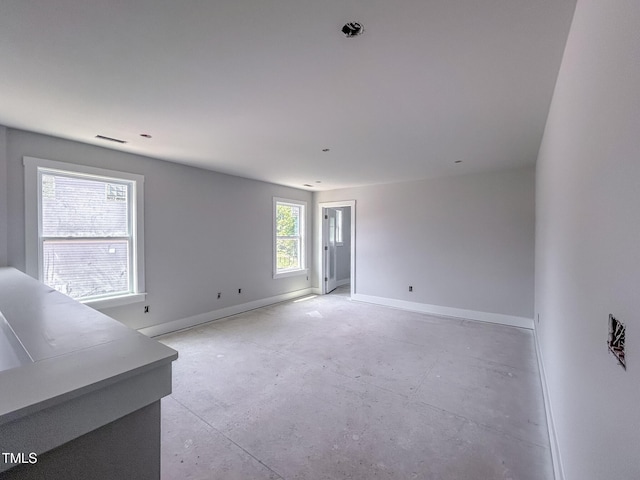 1905 Old Bramble Ln Unit 4, Fuquay Varina, NC 27526 - unfurnished living room with baseboards and concrete floors