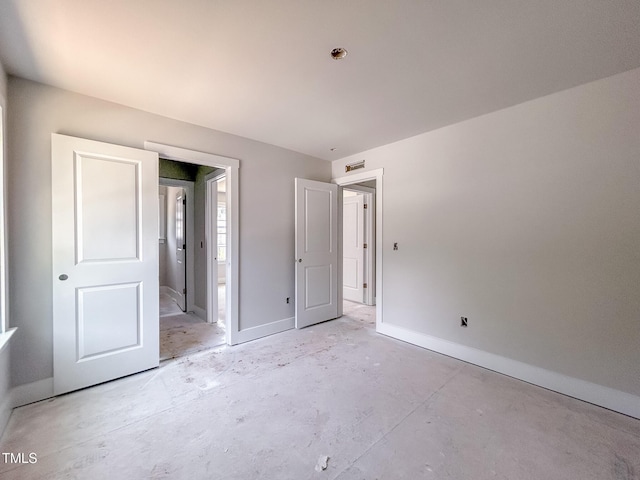 1905 Old Bramble Ln Unit 4, Fuquay Varina, NC 27526 - unfurnished bedroom featuring baseboards and concrete floors