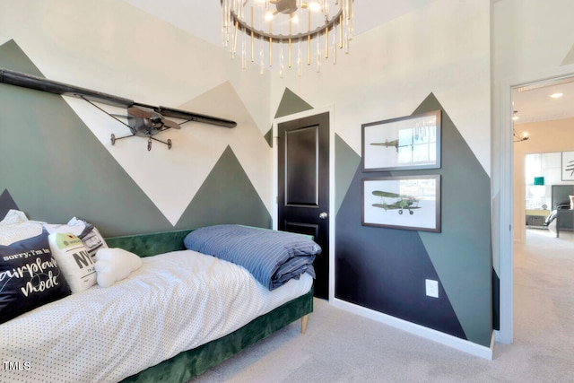 bedroom with a notable chandelier, baseboards, and light colored carpet