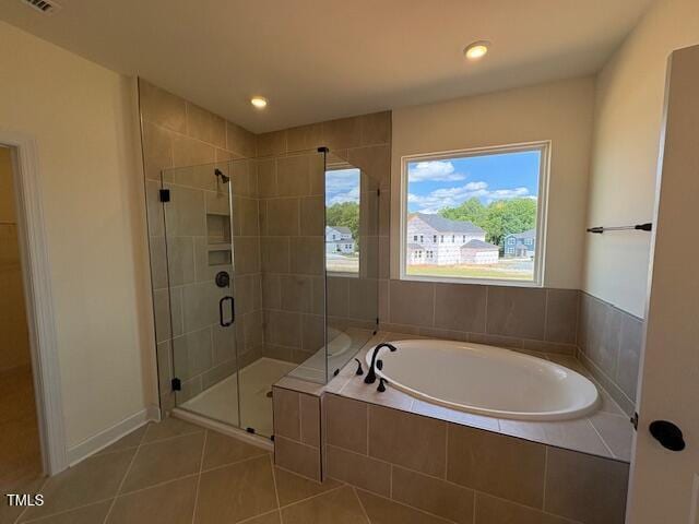 190 Sage Ln Unit 015, Four Oaks, NC 27524 - full bath with a bath, tile patterned flooring, a stall shower, healthy amount of natural light, and recessed lighting