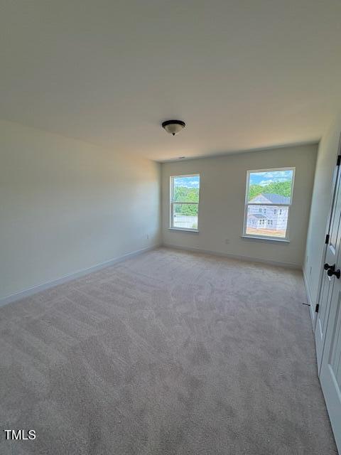 190 Sage Ln Unit 015, Four Oaks, NC 27524 - spare room with light colored carpet and baseboards