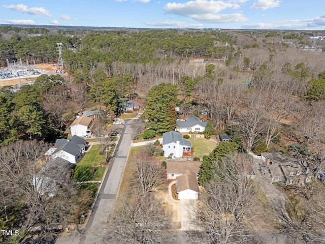 drone / aerial view featuring a view of trees