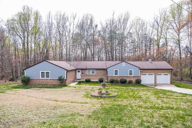 ranch-style home with a garage, brick siding, driveway, and a chimney