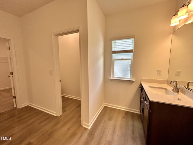 167 S Harvest Ridge Way Unit 223, Wilsons Mills, NC 27520 - bathroom with wood finished floors, vanity, and baseboards