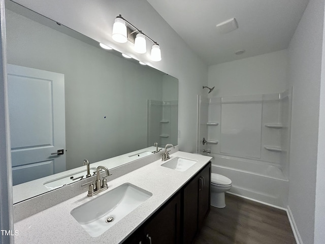 167 S Harvest Ridge Way Unit 223, Wilsons Mills, NC 27520 - bathroom featuring wood finished floors, toilet, bathtub / shower combination, double vanity, and baseboards