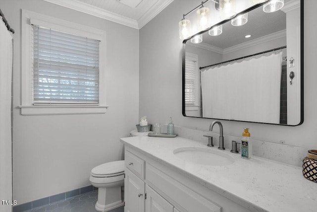 full bathroom with tile patterned flooring, toilet, vanity, baseboards, and crown molding