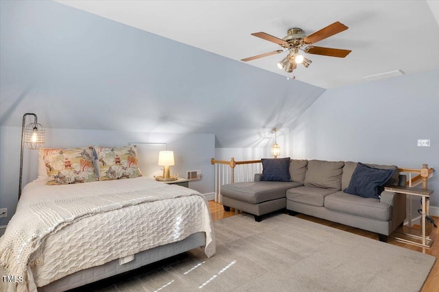 bedroom with lofted ceiling, ceiling fan, visible vents, and light wood-style flooring