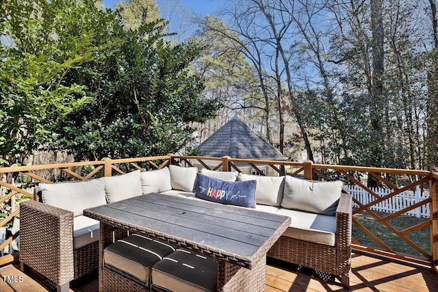 wooden terrace featuring an outdoor hangout area