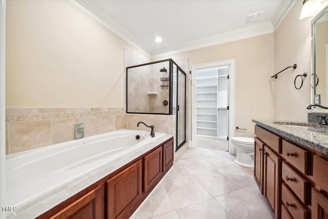 bathroom with a garden tub, toilet, vanity, a stall shower, and crown molding