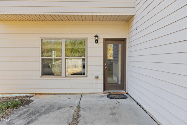 property entrance with a patio area