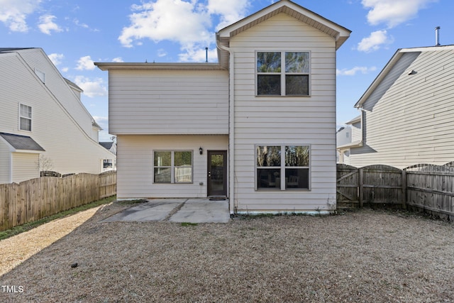 back of house with a patio and a fenced backyard