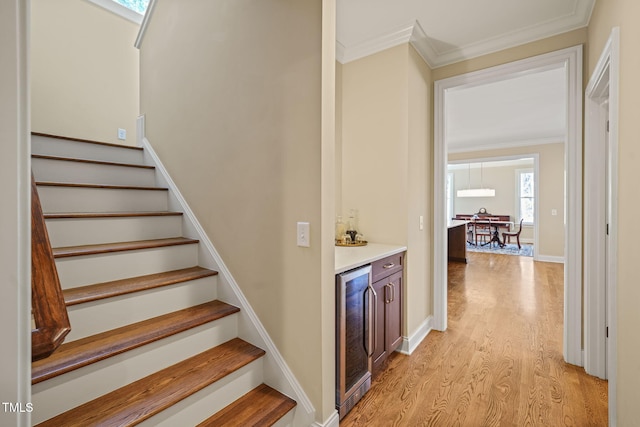 56 Mist Wood Ct, Pittsboro, NC 27312 - stairs with crown molding, a dry bar, wood finished floors, wine cooler, and baseboards