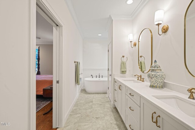 56 Mist Wood Ct, Pittsboro, NC 27312 - bathroom featuring crown molding, double vanity, a freestanding tub, and a sink