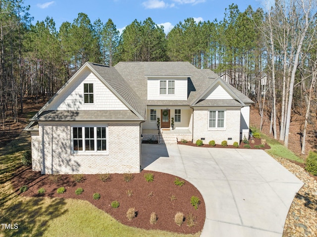 56 Mist Wood Ct, Pittsboro, NC 27312 - view of front of home with roof with shingles, brick siding, driveway, and crawl space