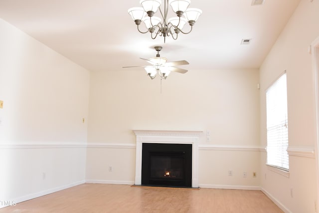 unfurnished living room with baseboards, a fireplace with flush hearth, visible vents, and light wood-style floors