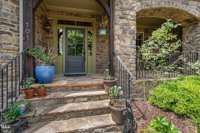 property entrance with stone siding