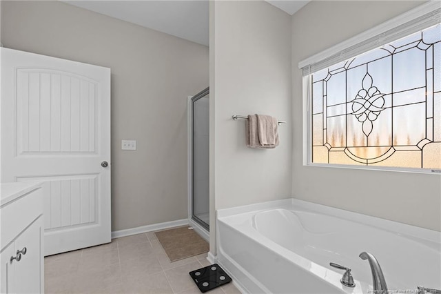 bathroom featuring vanity, tile patterned flooring, a shower stall, and a bath