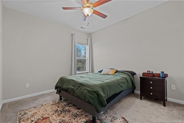 bedroom with baseboards, visible vents, a ceiling fan, and light colored carpet