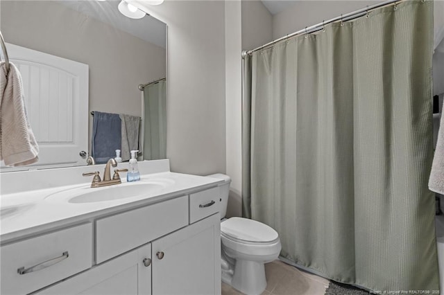 bathroom with tile patterned floors, curtained shower, and vanity