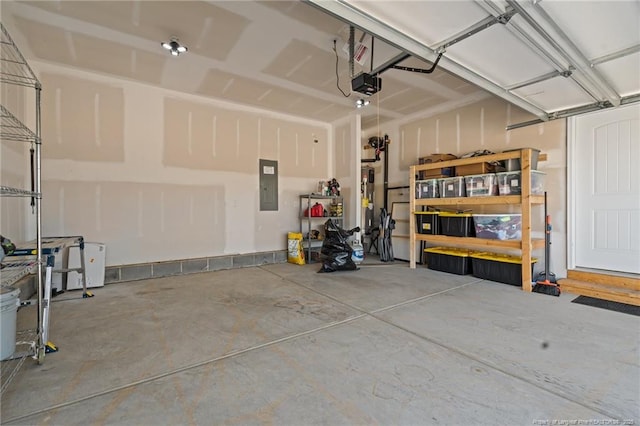 garage featuring a garage door opener and electric panel