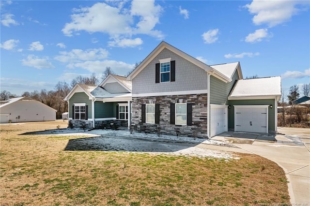 craftsman inspired home with a front lawn, concrete driveway, stone siding, and an attached garage