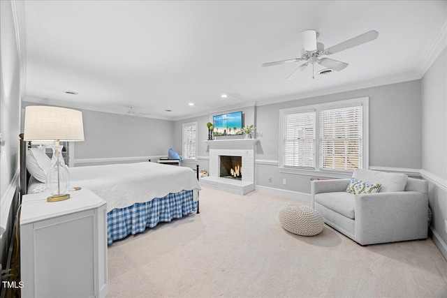 carpeted bedroom with recessed lighting, a ceiling fan, baseboards, a brick fireplace, and crown molding