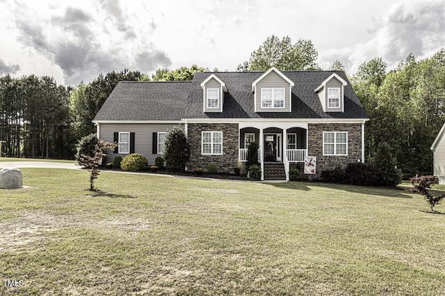 cape cod-style house featuring a porch, stone siding, and a front lawn